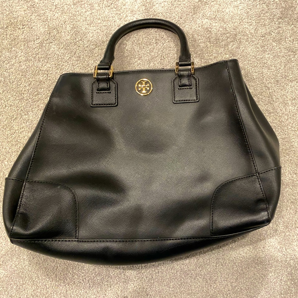 Handbag with adaptable shoulder strap